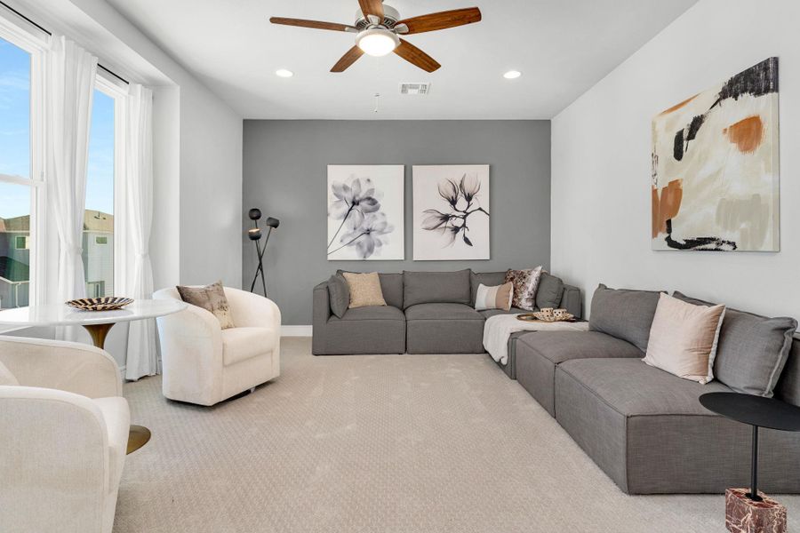 Carpeted living room with ceiling fan and recessed lighting Carpeted living room with ceiling fan and recessed lighting