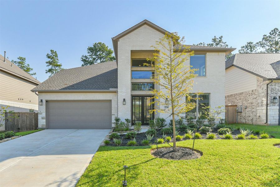 Front exterior of a new home in The Woodlands Hills – 55', Willis, TX, highlighting curb appeal (Image 1).