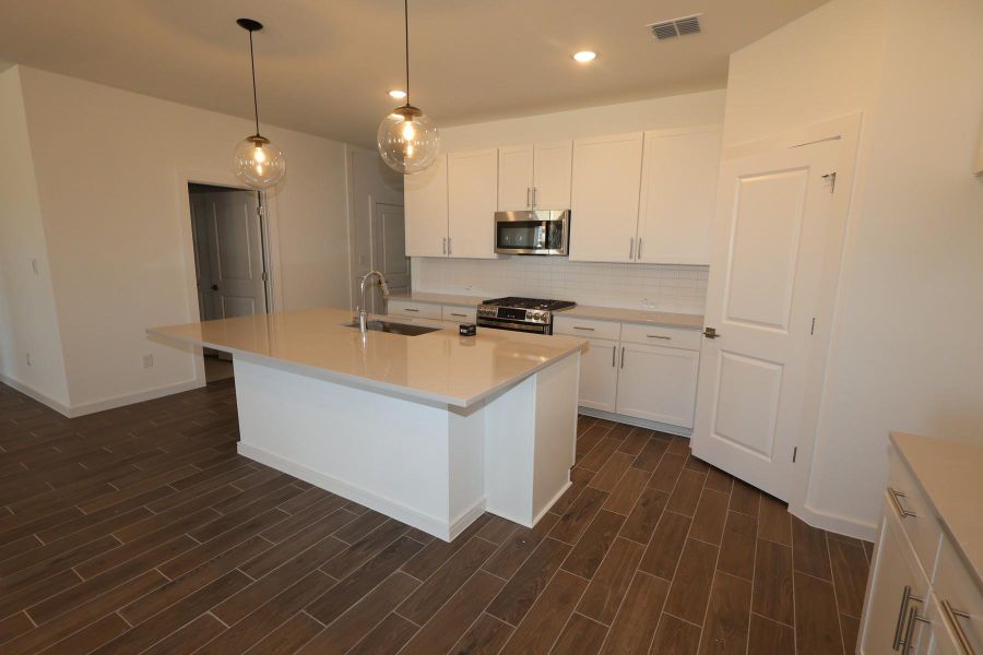 Furnished interior view inside a new home in Aspire at Ashland, Angleton (Image 4).