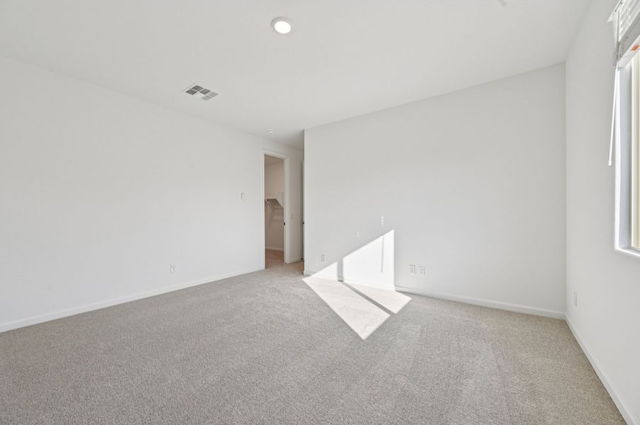 Primary suite. Finishes and options may vary by community.