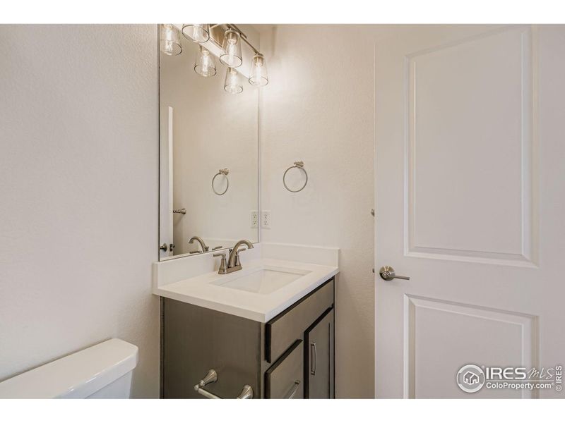 Furnished interior view inside a new home in RainDance - 60s, Windsor (Image 11).