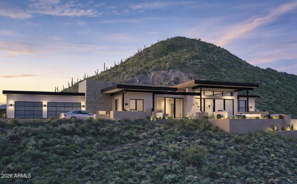 Modern desert home at sunset