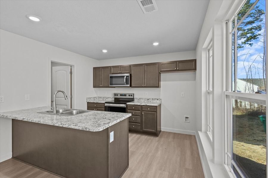 Representative furnished interior of a home built from the Roebuck by Enchanted Homes in Las Palomas Country Club Estates, La Vernia (Image 6).