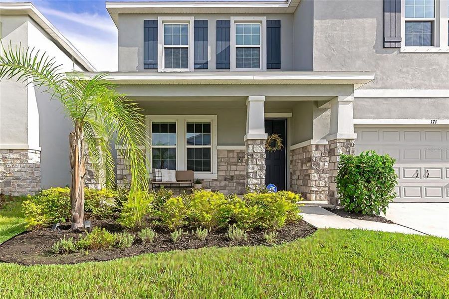 Front exterior of a new home in , Apollo Beach, FL, highlighting curb appeal (Image 31).