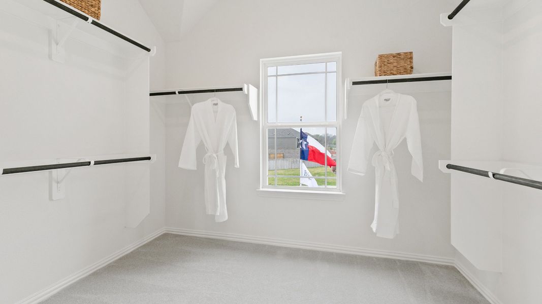 Representative furnished interior of a home built from the Mimosa by Brightland Homes in Sunterra, Katy (Image 23).