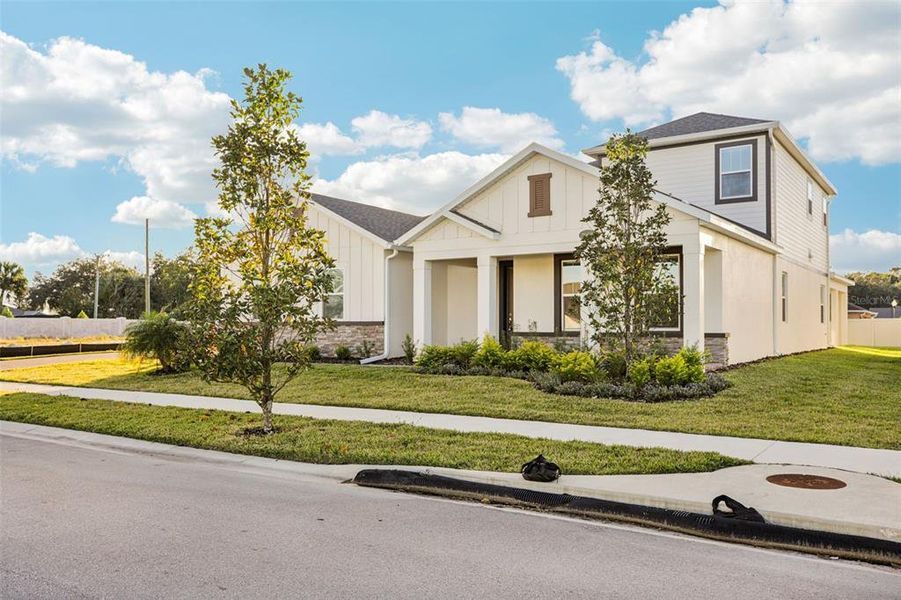 Front exterior of a new home in Hawk's Overlook, Oviedo, FL, highlighting curb appeal (Image 23).