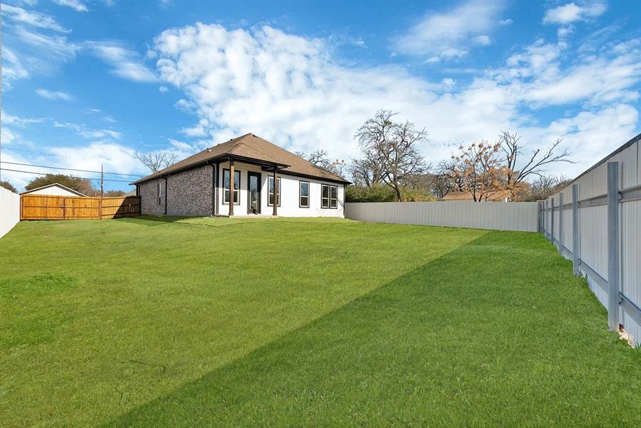 View of fenced backyard
