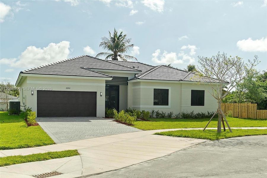 Front exterior of a new home in , Cutler Bay, FL, highlighting curb appeal (Image 23).