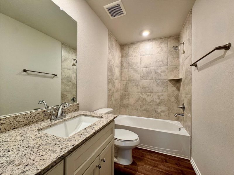 Furnished interior in a model home at Hill & Dale Ranch in Splendora (Image 7).