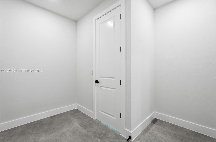 Walk in closet with access to laundry Walk in closet with access to laundry