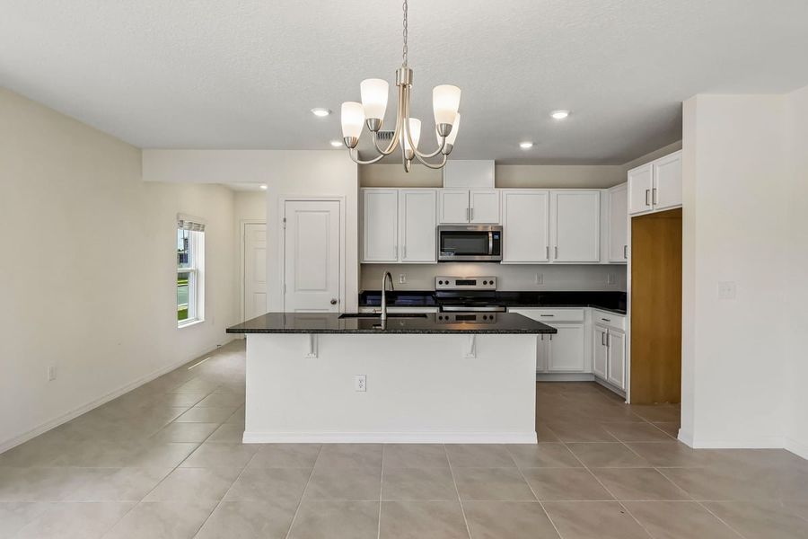 Furnished interior view inside a new home in Reserve at Forest Lake Townhomes, Lake Wales (Image 6).