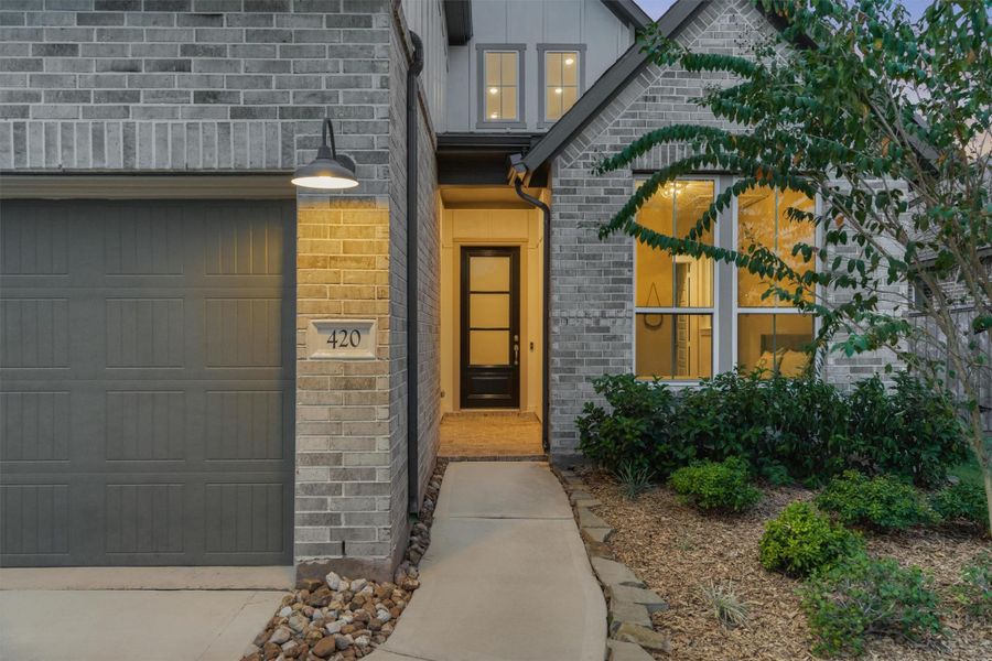 Exterior details and patio area of a home in Woodforest 50′, Montgomery (Image 26).