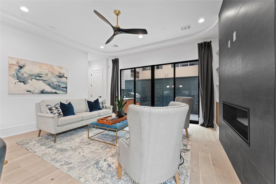 Spacious living room with western sliding door and modern fireplace.
