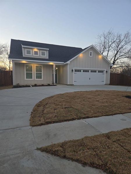 View of front facade featuring a garage