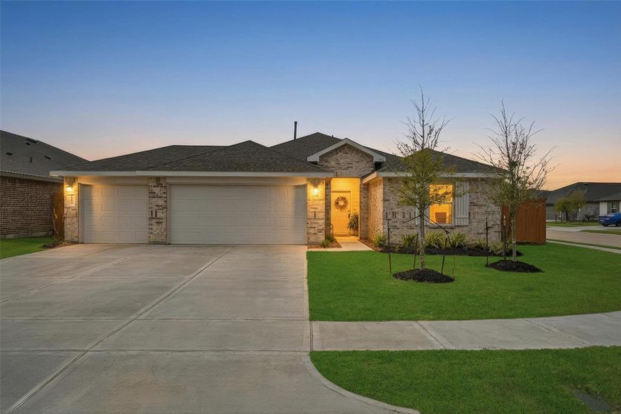 Front exterior of a new home in River Ranch Meadows, Dayton, TX, highlighting curb appeal (Image 2). Front exterior of a new home in River Ranch Meadows, Dayton, TX, highlighting curb appeal (Image 2).