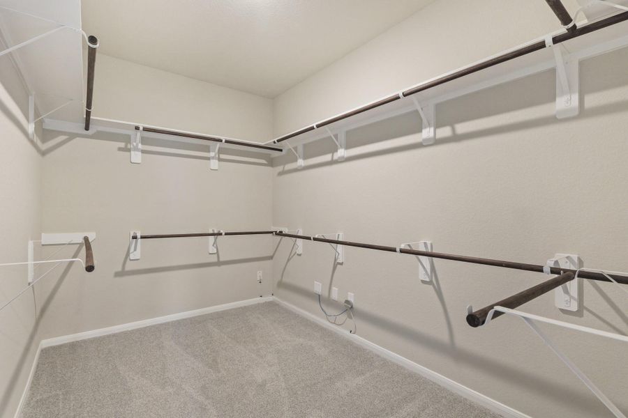 Huge walk-in closet in owner's suite Huge walk-in closet in owner's suite