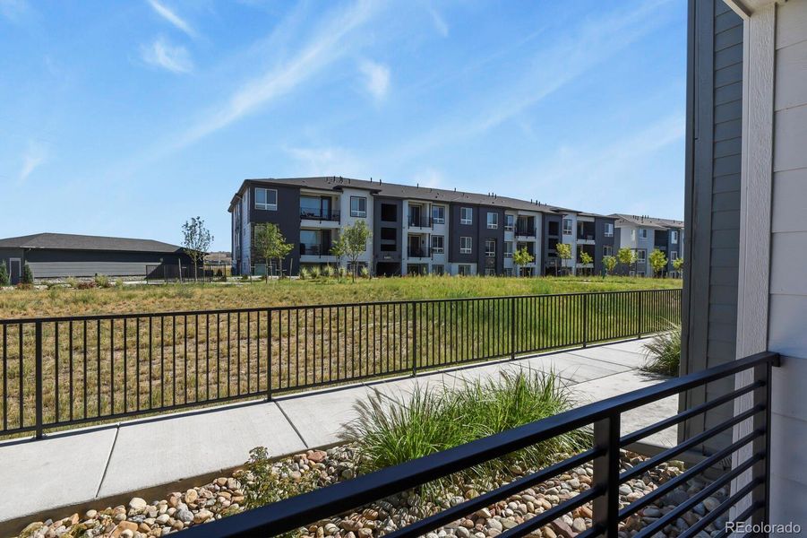 Front exterior of a new home in Stonegate Condos, Parker, CO, highlighting curb appeal (Image 22).