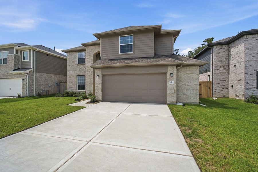 Front exterior of a new home in Sundance Cove, Crosby, TX, highlighting curb appeal (Image 2). Front exterior of a new home in Sundance Cove, Crosby, TX, highlighting curb appeal (Image 2).