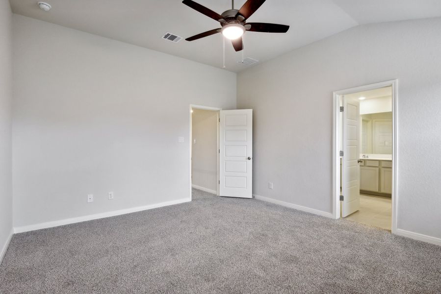 Primary suite in the Red River floorplan at a Meritage Homes community.