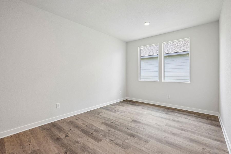 Spacious, unfurnished interior of a new home in Stallion Run, Buda (Image 36).