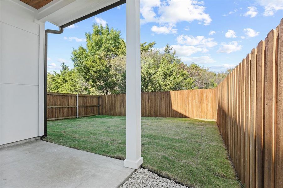 Fenced backyard featuring a patio area