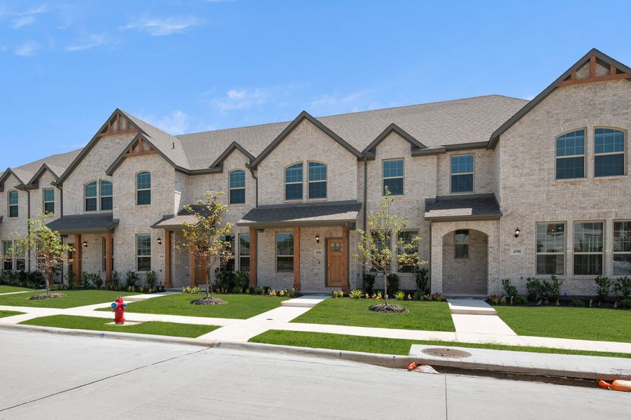 Front exterior of a new home in Sanger Circle – Townhomes, Sanger, TX, highlighting curb appeal (Image 2). Front exterior of a new home in Sanger Circle – Townhomes, Sanger, TX, highlighting curb appeal (Image 2).