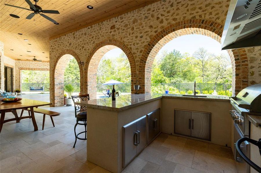 Outdoor kitchen with smoker, gas grill and commercial vent hood Outdoor kitchen with smoker, gas grill and commercial vent hood