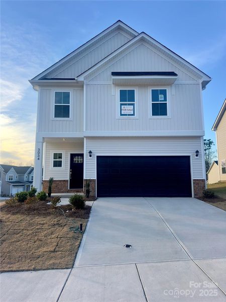 Front exterior of a new home in , Charlotte, NC, highlighting curb appeal (Image 1). Front exterior of a new home in , Charlotte, NC, highlighting curb appeal (Image 1).