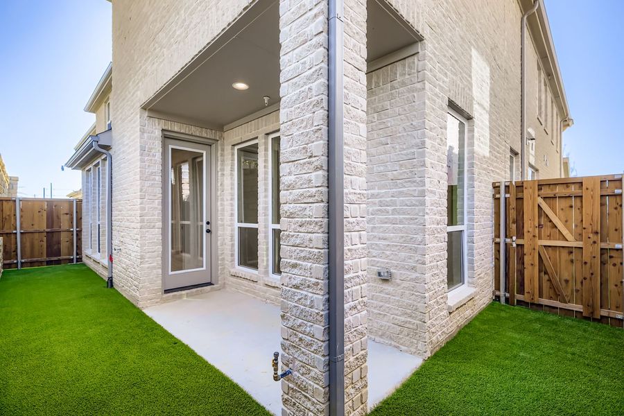Exterior details and patio area of a home in Castle Hills Northpointe - Townhomes, Carrollton (Image 17). Exterior details and patio area of a home in Castle Hills Northpointe - Townhomes, Carrollton (Image 17).