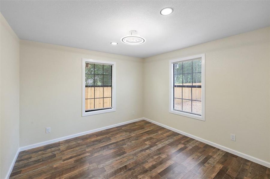 Unfurnished room with hardwood / wood-style floors