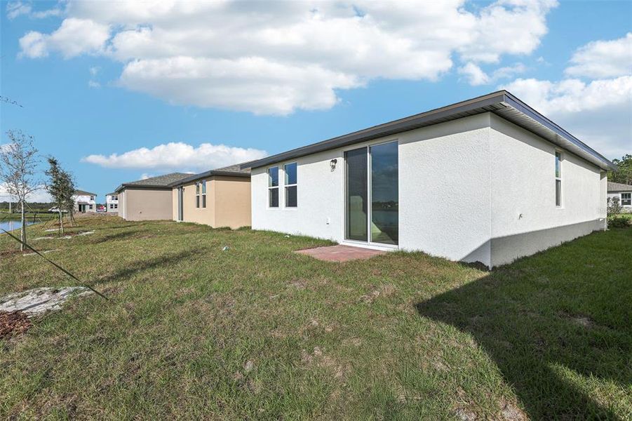 Exterior details and patio area of a home in Lake Deer Estates - Classic Series, Poinciana (Image 19).