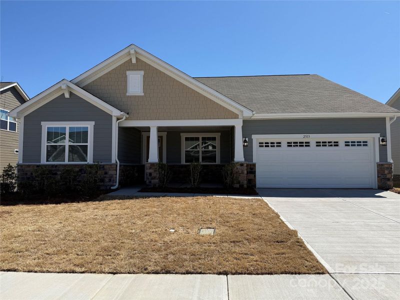 Front exterior of a new home in Waxhaw Landing, Monroe, NC, highlighting curb appeal (Image 1).