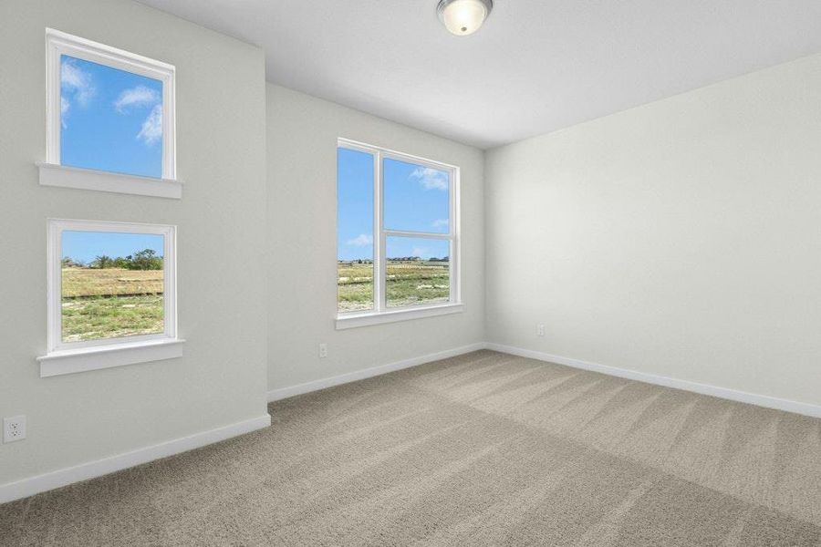 Spare room with carpet floors and baseboards