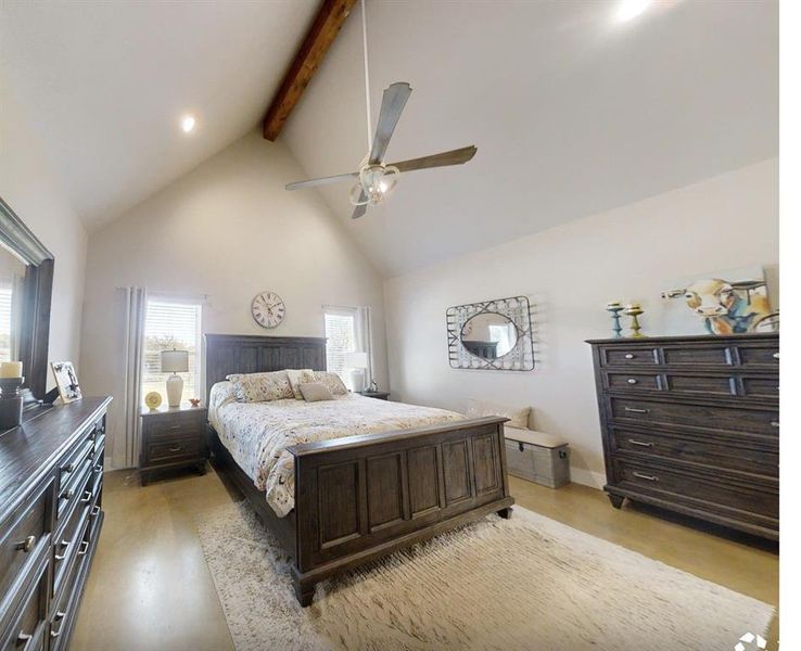 Bedroom featuring high vaulted ceiling, beamed ceiling, a ceiling fan, and recessed lighting Bedroom featuring high vaulted ceiling, beamed ceiling, a ceiling fan, and recessed lighting