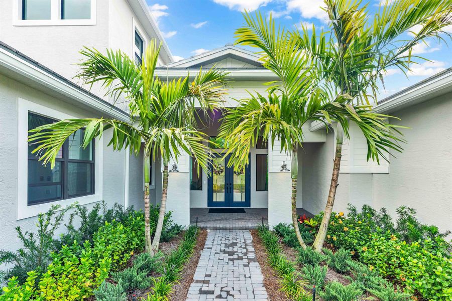 Front exterior of a new home in , Palm City, FL, highlighting curb appeal (Image 1). Front exterior of a new home in , Palm City, FL, highlighting curb appeal (Image 1).