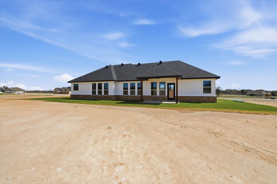 Exterior details and patio area of a home in Zion Valley, Poolville (Image 3).