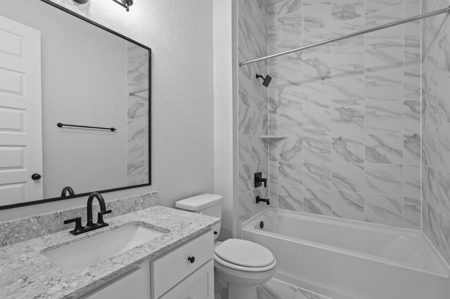 A bathroom with a shower and sink. A bathroom with a shower and sink.