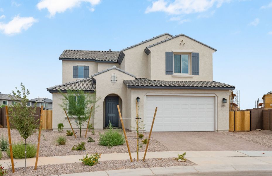 Front exterior of a new home in Artisan at Asante, Surprise, AZ, highlighting curb appeal (Image 22).