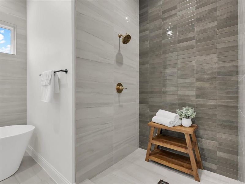 Bathroom featuring tile patterned floors and a tub