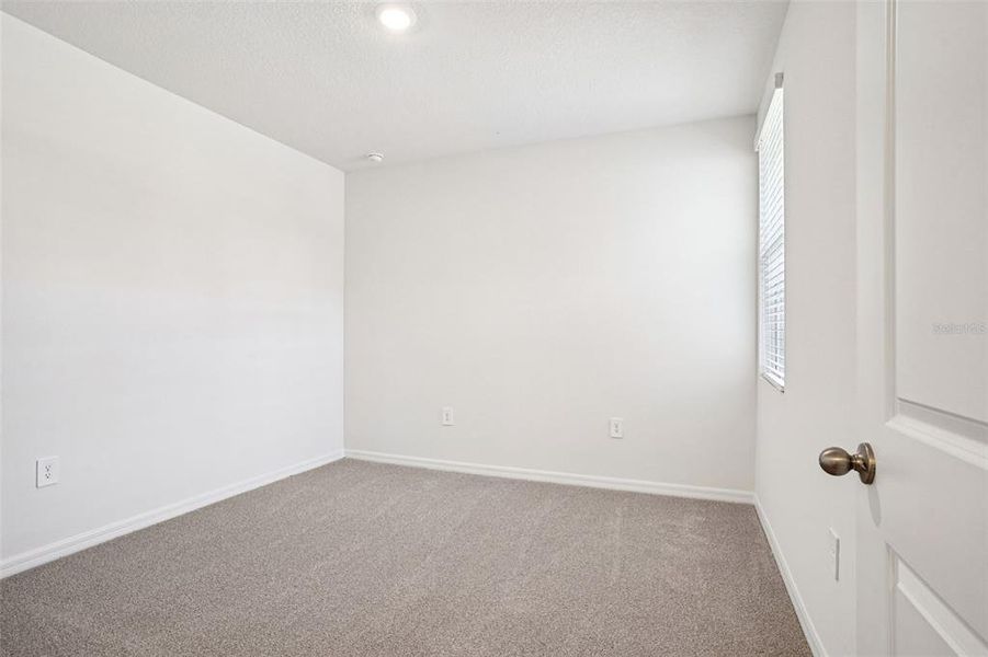 Spacious, unfurnished interior of a new home in Ridgehaven - Villas, Ormond Beach (Image 30).