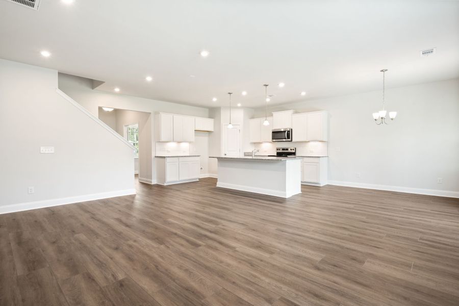 Open Concept Gathering Room with Hardwood Floors Open Concept Gathering Room with Hardwood Floors