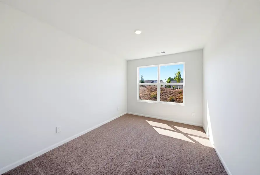 Spacious, unfurnished interior of a new home in Sweetbrier, Durham (Image 28).