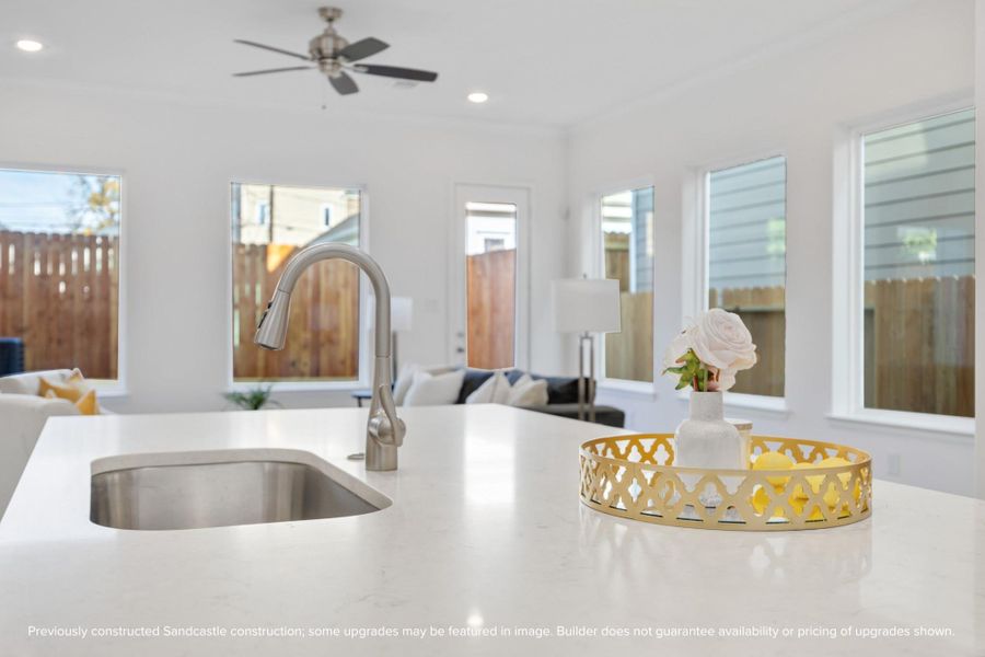 Designer Finishes MeetEveryday Function: Timeless meets trendy in this gourmet kitchen with Benedettini cabinets with soft-close drawers, quartz countertops, and custom design selections.The open layout keeps you connected to the living and dining spaces beyond.