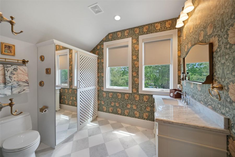 This bathroom in the au pair suite is thoughtfully designed and is plumbed for a washer and dryer, with convenient connections already in place.