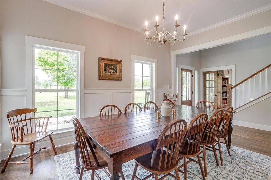 Dining area off entry with chandelier. Dining area off entry with chandelier.