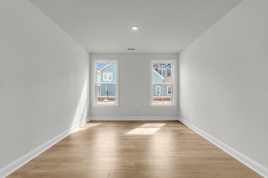 Spacious, unfurnished interior of a new home in Tidewater at Lakes of Cane Bay, Summerville (Image 39).