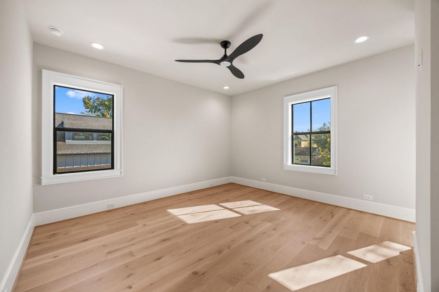 Secondary Bedrooms are spacious & offer wood floors, large windows, walk-in closets & en-suite bathroom.