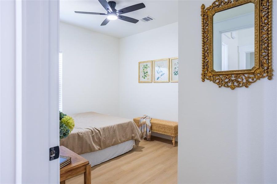 Bedroom featuring a ceiling fan and wood finished floors
