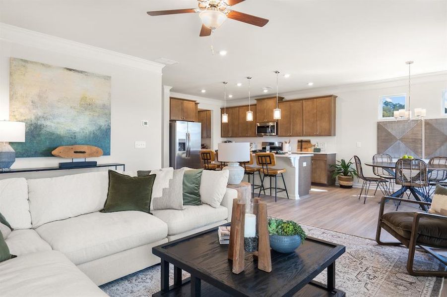 The James- Family Room into the Kitchen. Home under construction. Sample floor plan photo used for illustrative purposes only. Upgrades, selections options, windows and colors may vary.