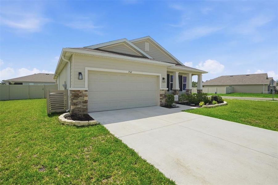 Front exterior of a new home in Waterford, Brooksville, FL, highlighting curb appeal (Image 23).